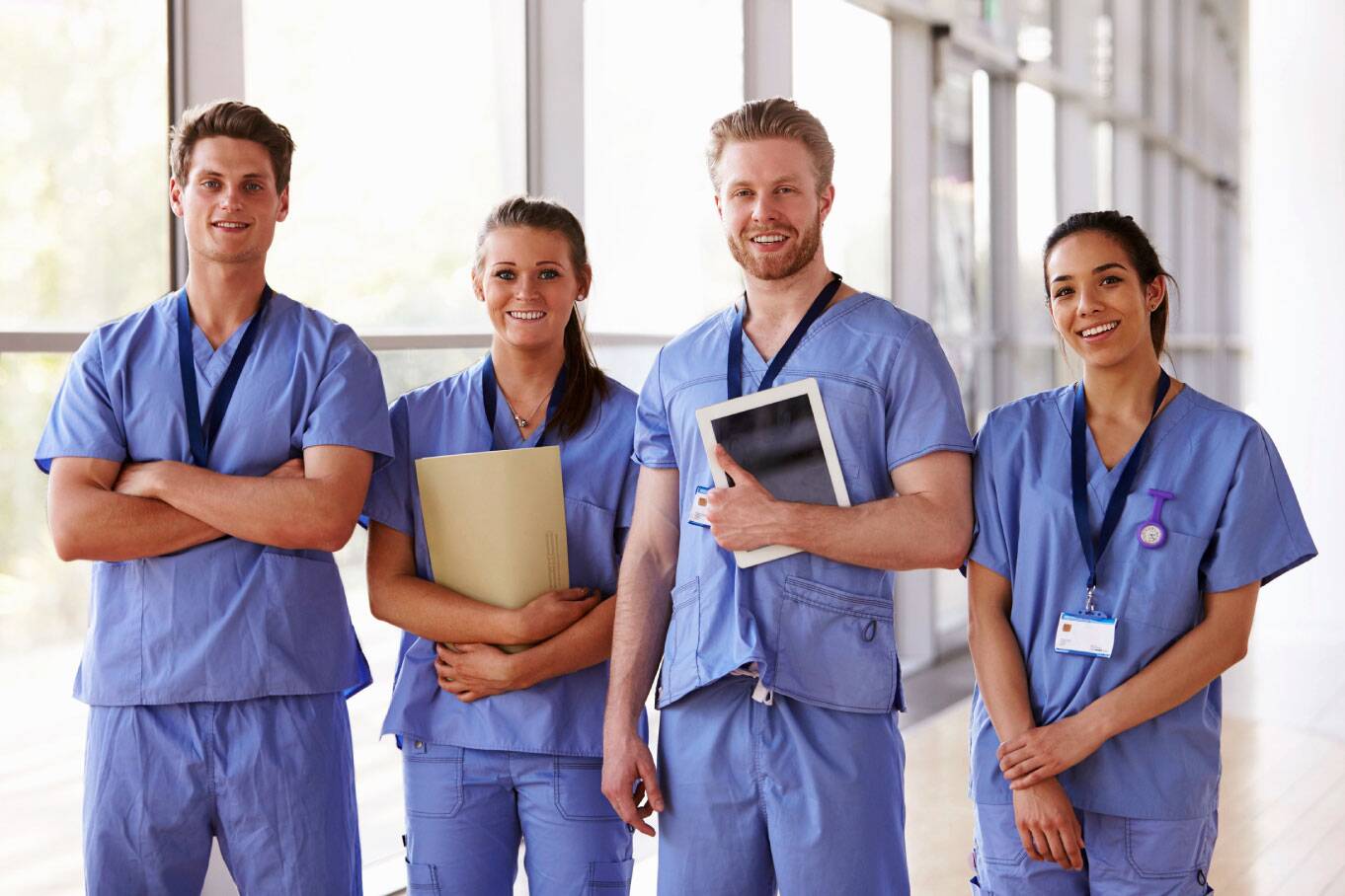 Four friendly healthcare receptionists