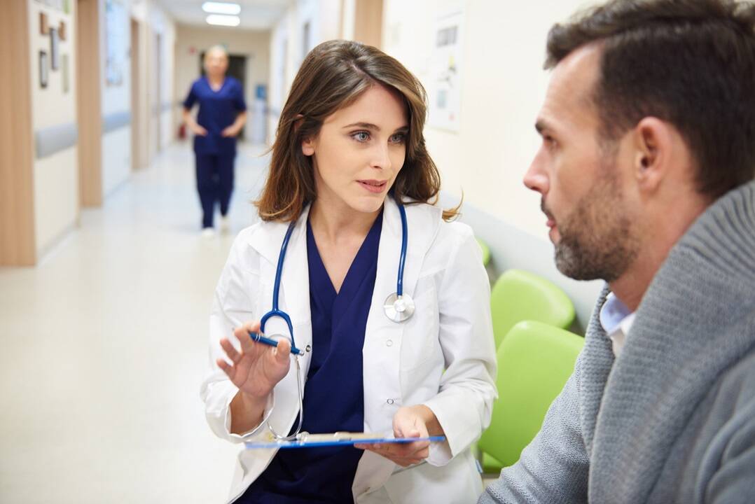 Doctor implementing patient experience trends to communicate with patient