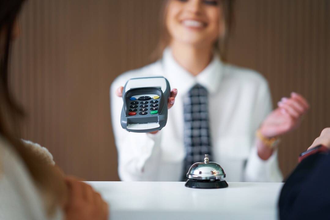 Receptionist helping decreasing cost-to-collect revenue cycle healthcare