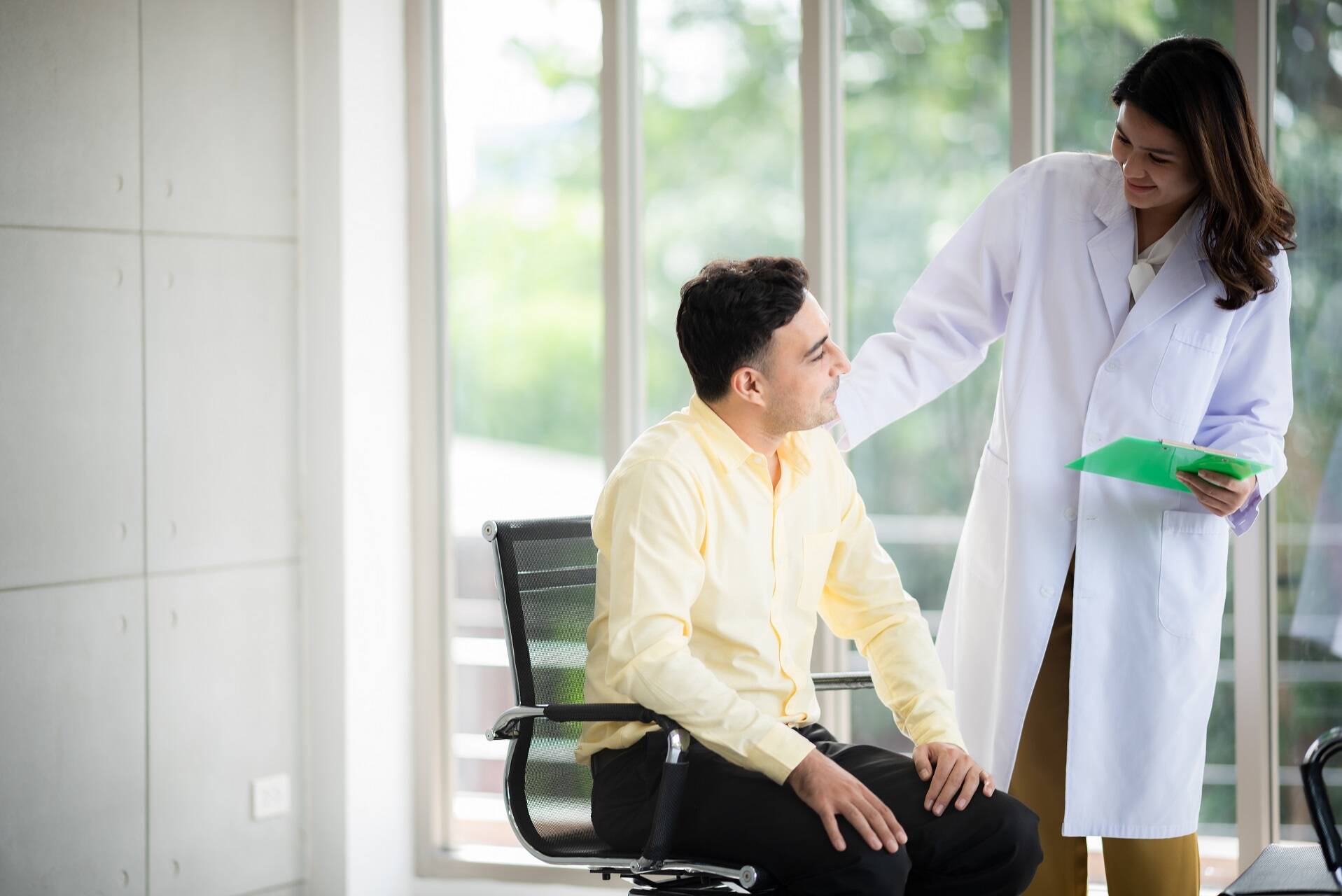 Patient talking to doctor after being admitted by mental health clinic receptionist