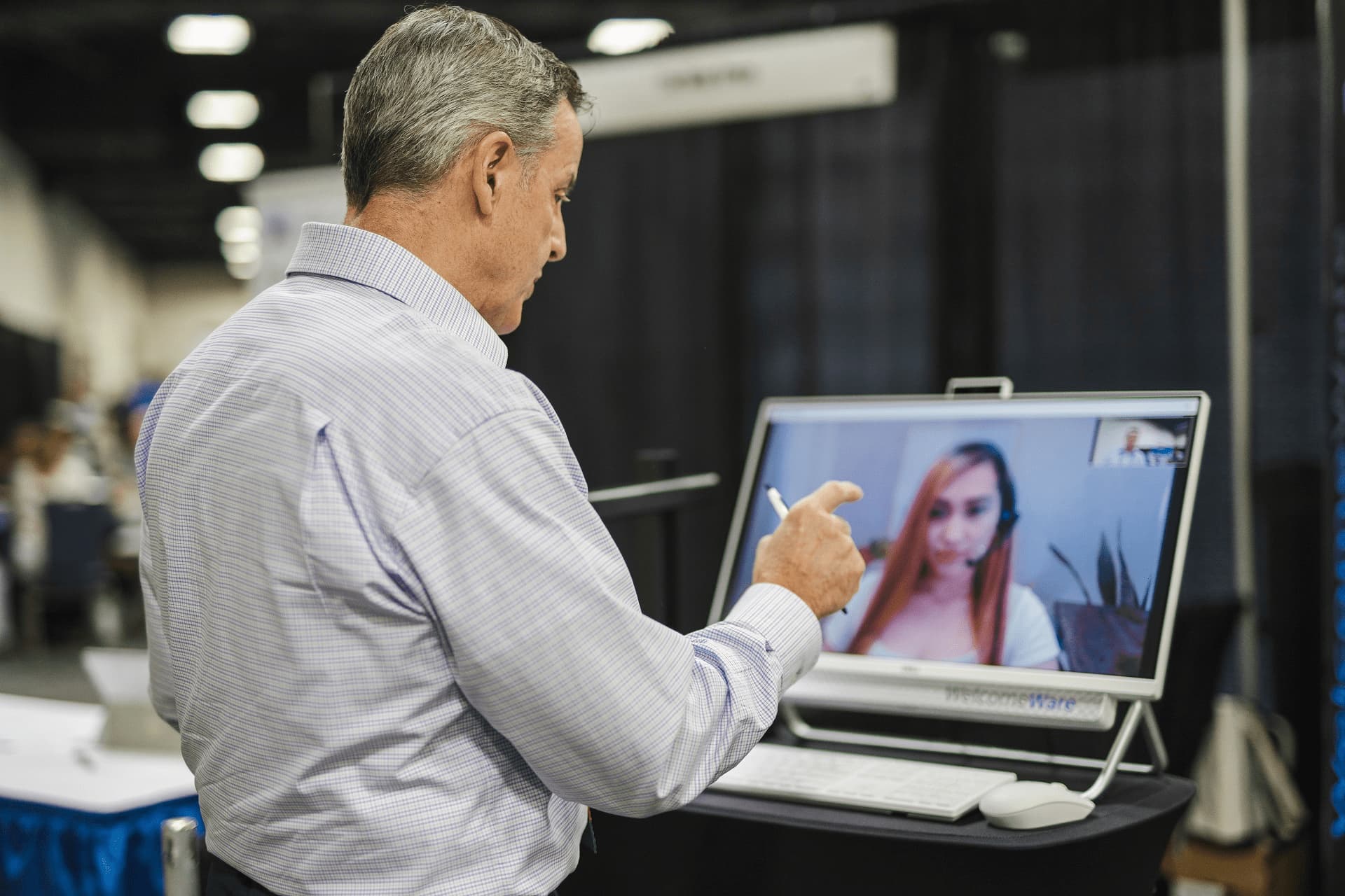 Patient using PT virtual medical receptionist kiosk